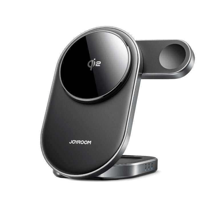 A folded JOYROOM JR-W17 3-in-1 Qi2 Magnetic Wireless Charging Stand simultaneously charging an iPhone, an Apple Watch, and Air Pods on a clean, modern desk.